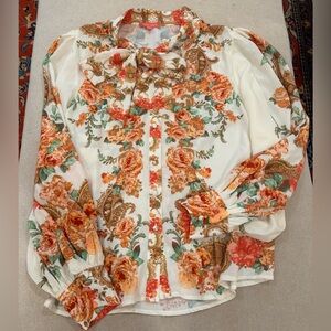 Floral blouse with bow tie neck